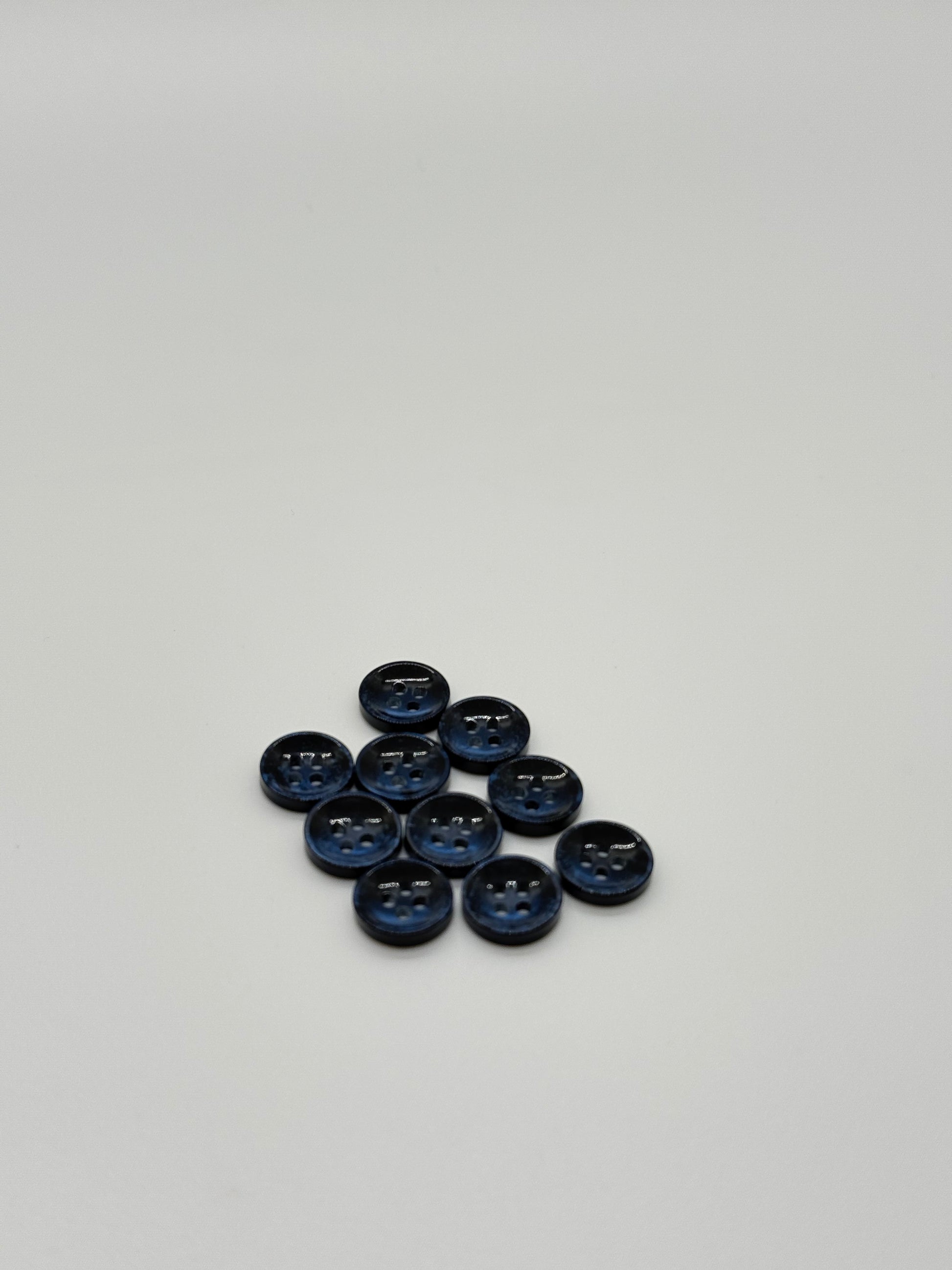 Close-up image of Pearl Blue Sunken Button, a premium quality button.