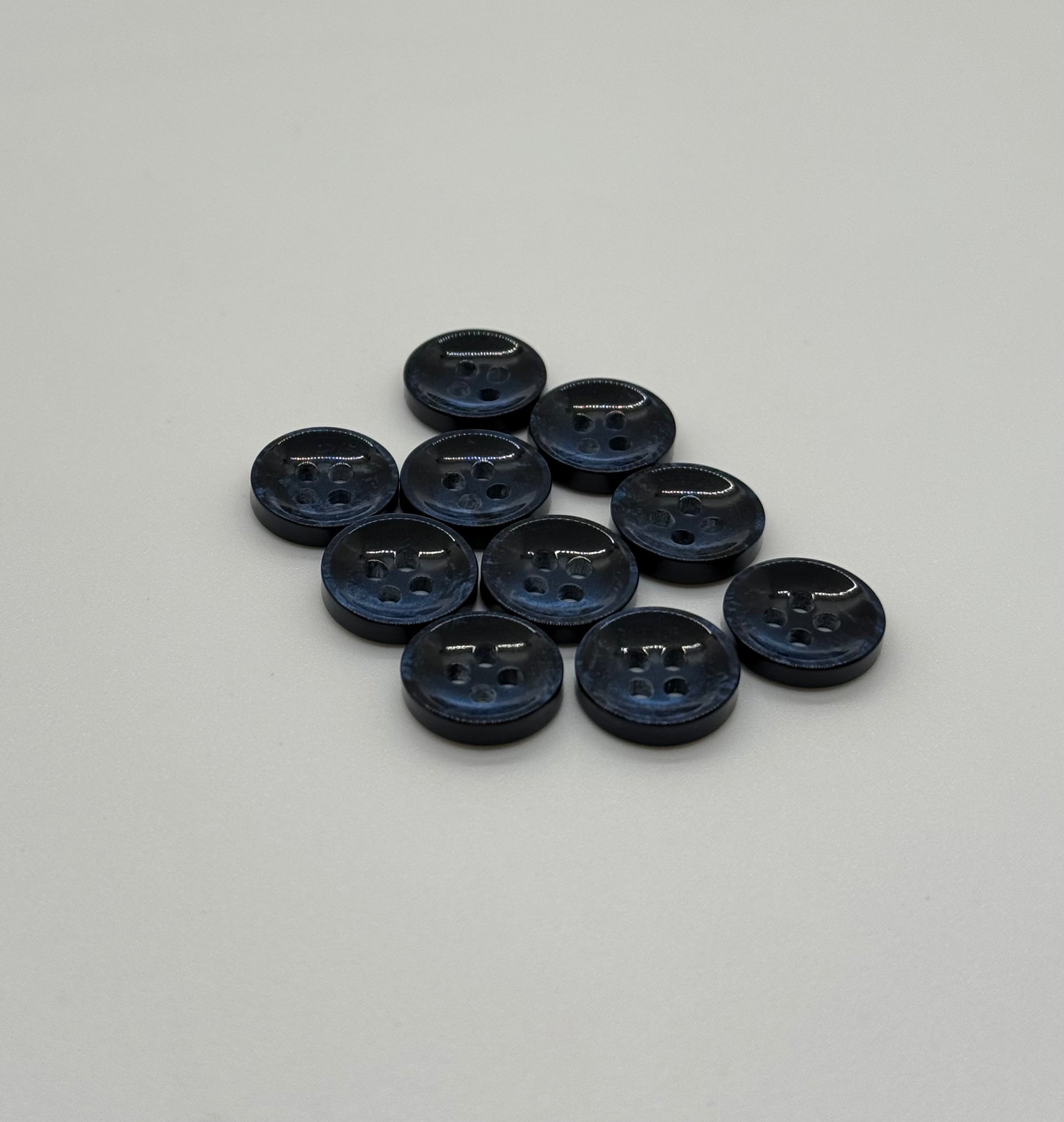 Close-up image of Pearl Blue Sunken Button, a premium quality button.