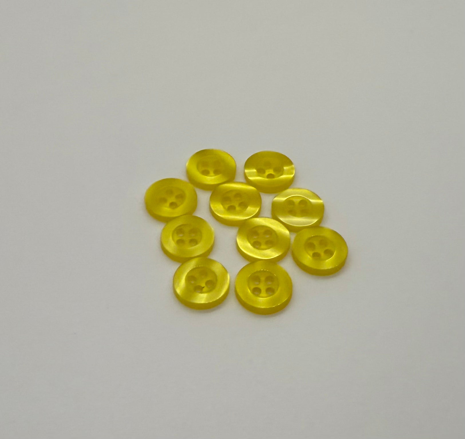 Close-up image of Yellow Resin, a premium quality button.