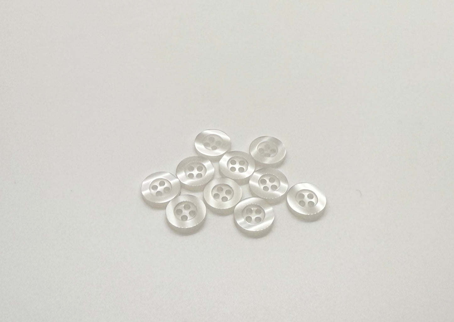 Close-up image of Ghost White Resin, a premium quality button.