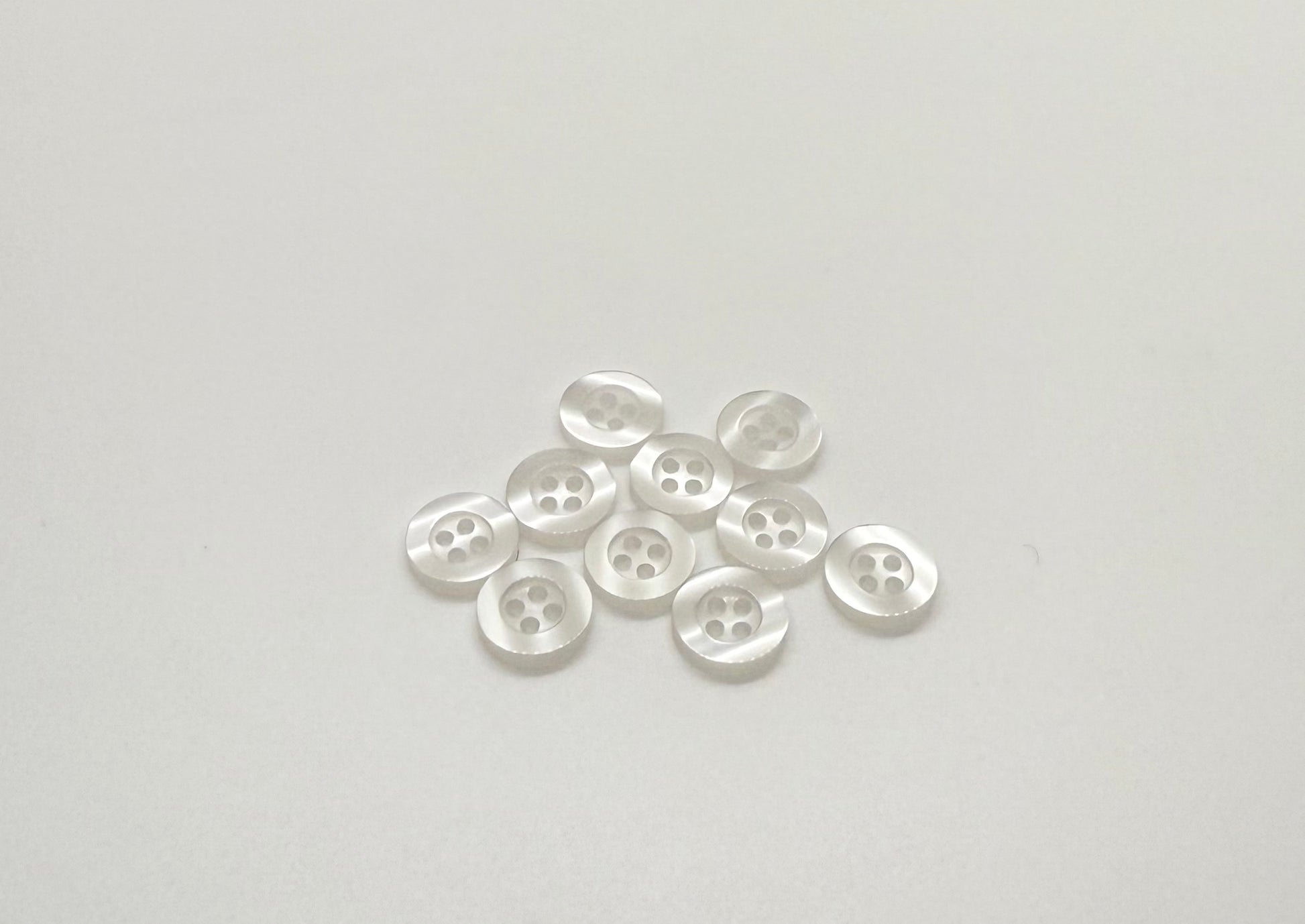 Close-up image of Ghost White Resin, a premium quality button.
