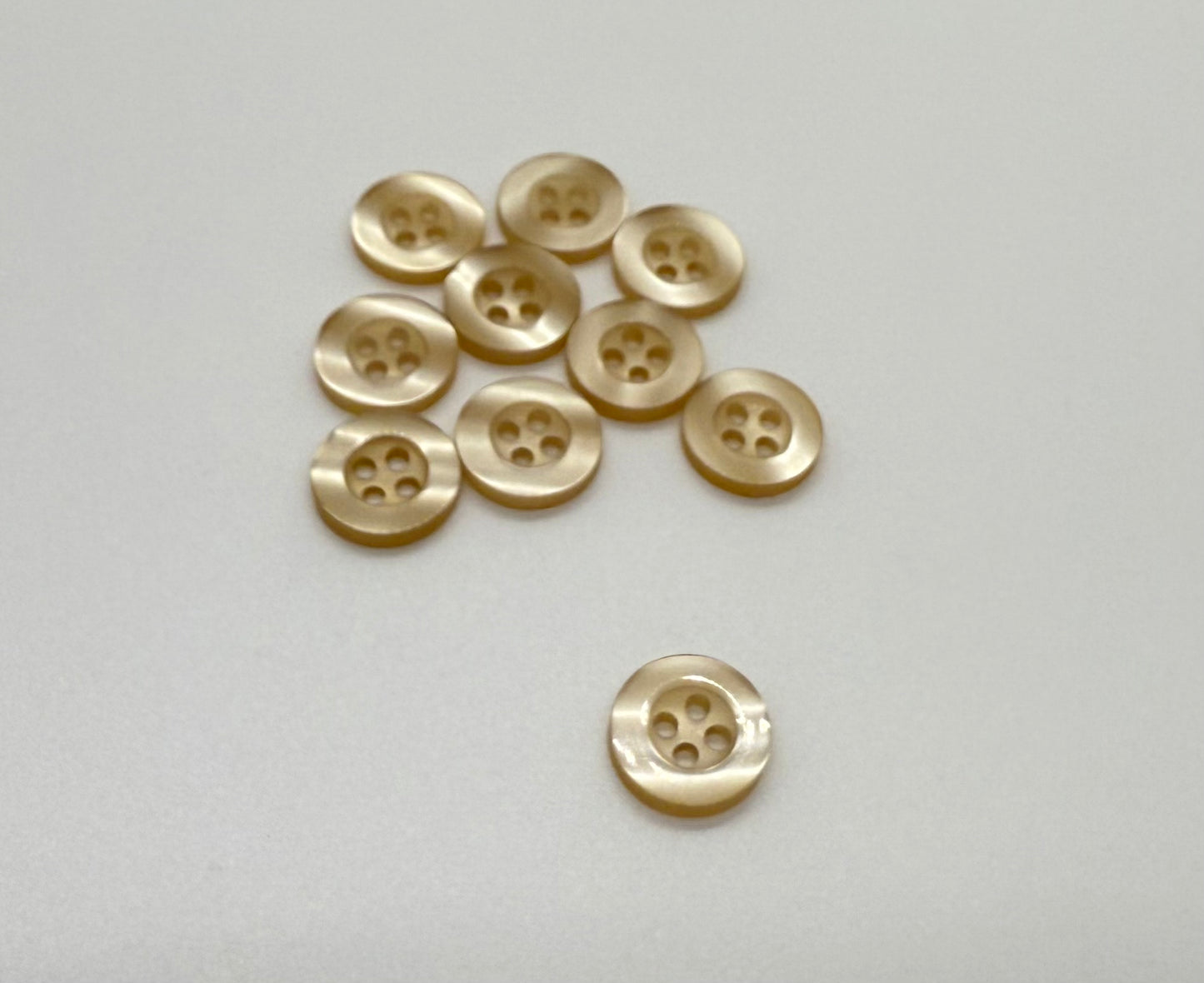 Close-up image of Balsa Cream Resin, a premium quality button.