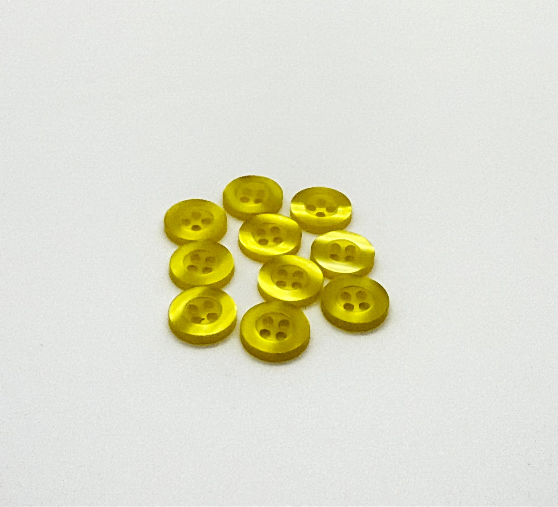 Close-up image of Yellow Resin, a premium quality button.