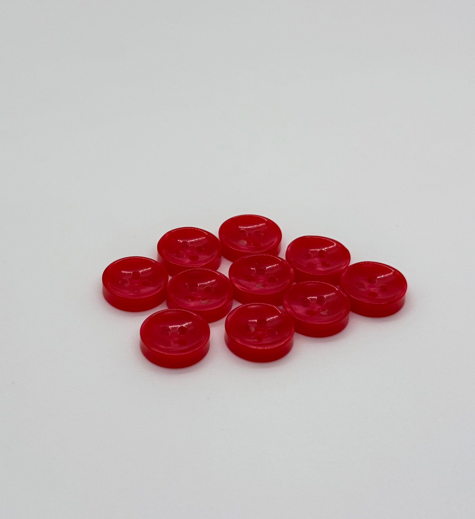 Close-up image of Red Sunken Button, a premium quality button.