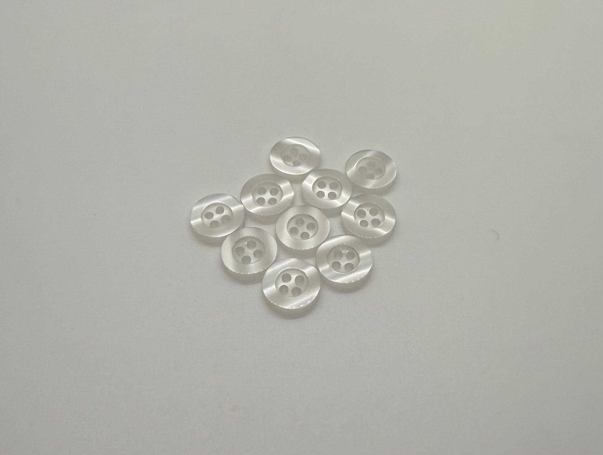 Close-up image of Ghost White Resin, a premium quality button.