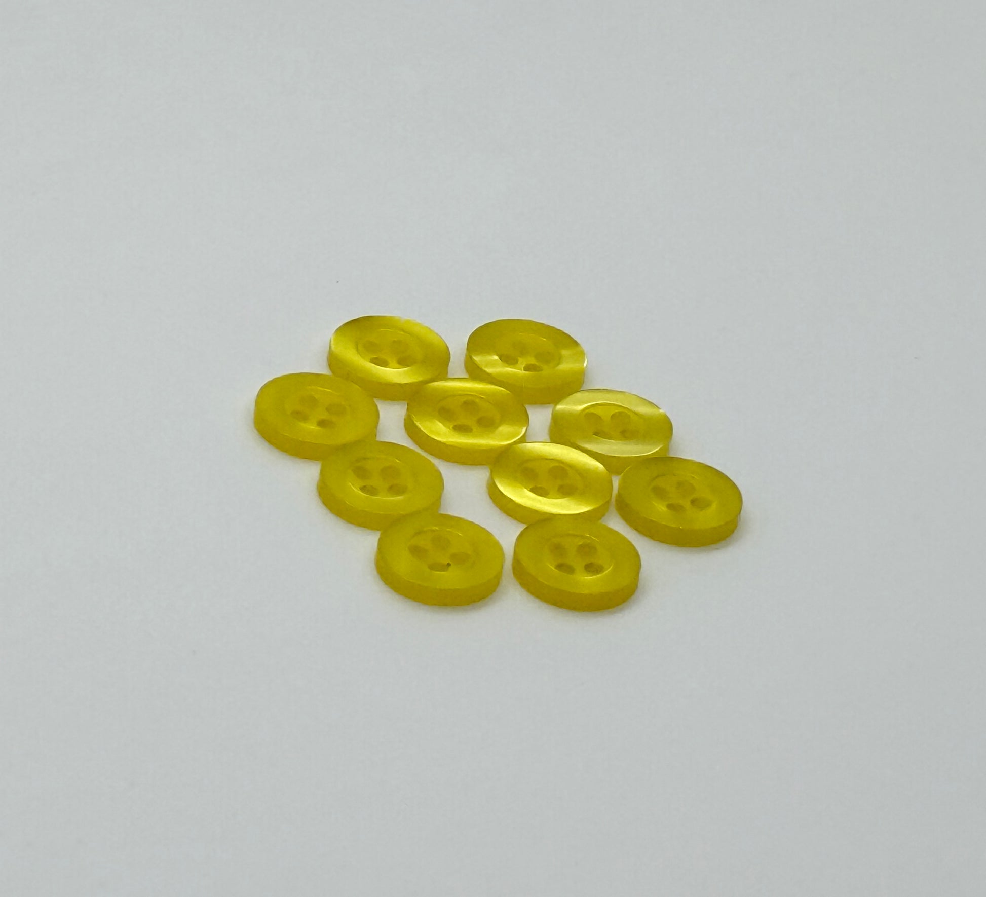 Close-up image of Yellow Resin, a premium quality button.