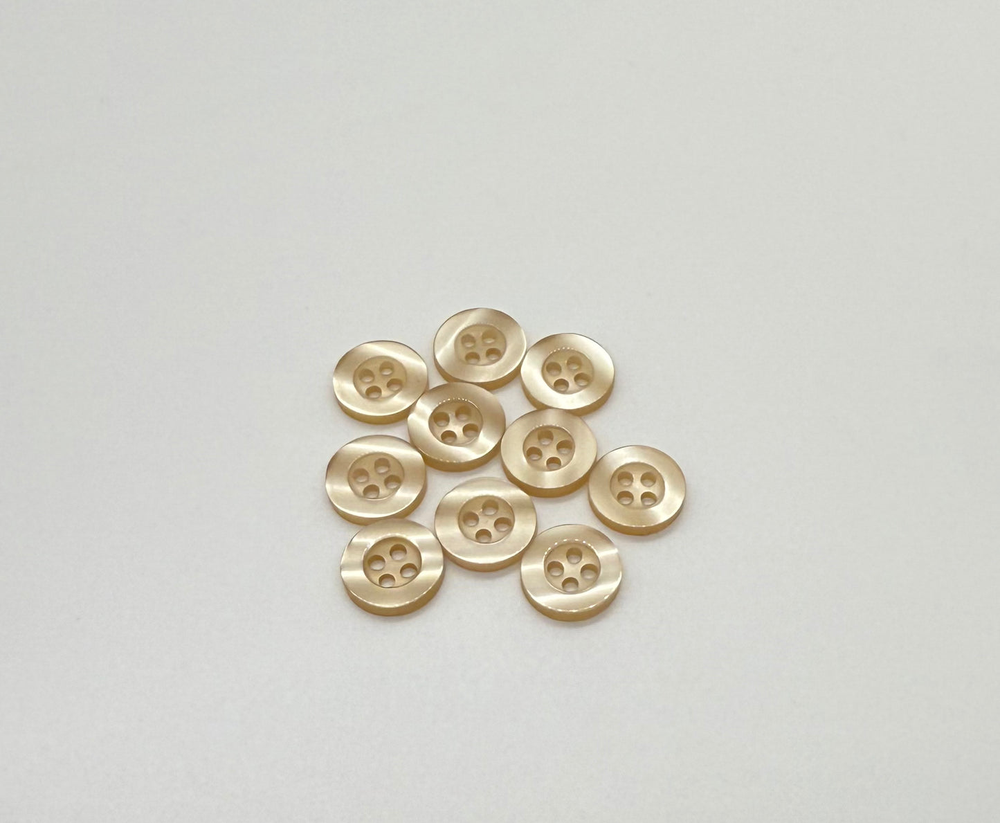 Close-up image of Balsa Cream Resin, a premium quality button.