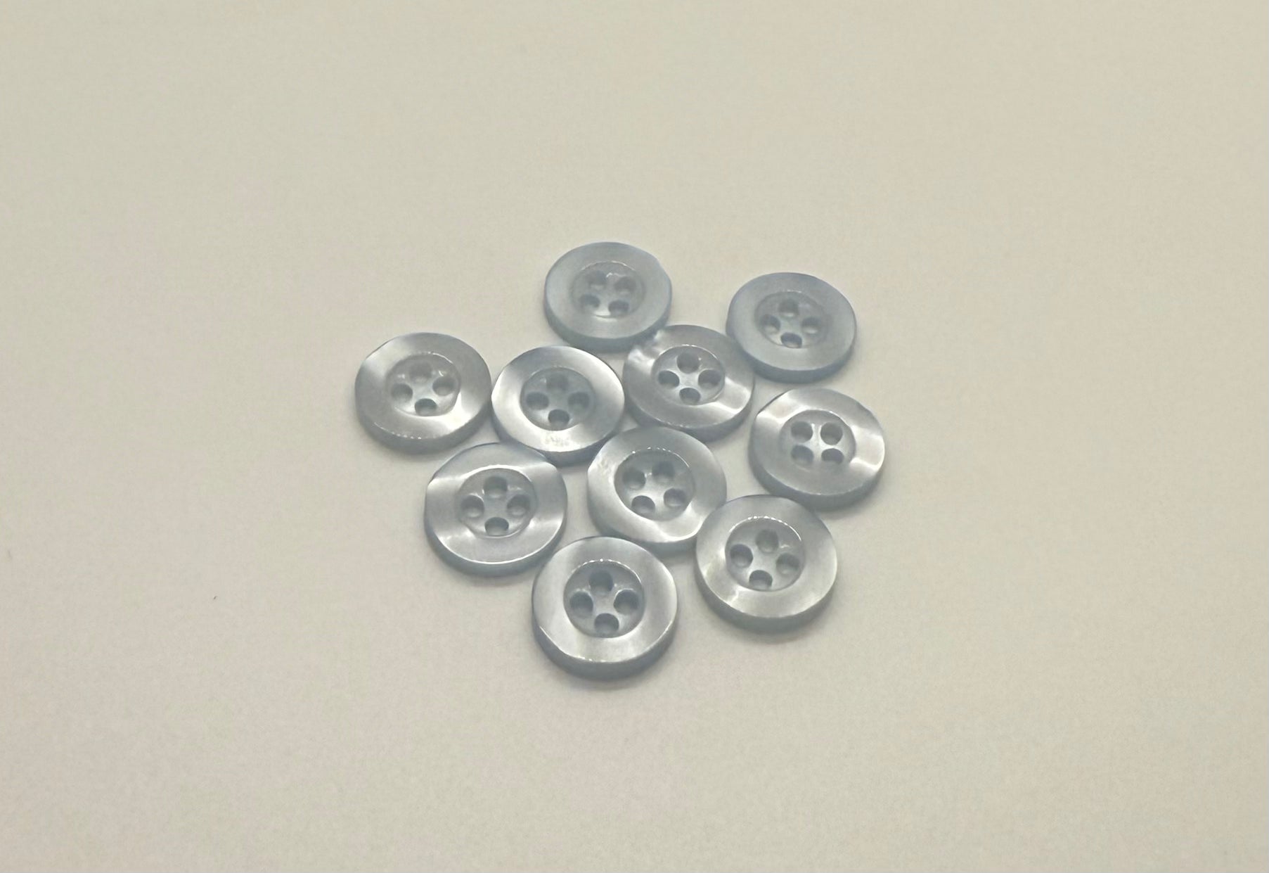 Close-up image of Pool water Blue Resin, a premium quality button.