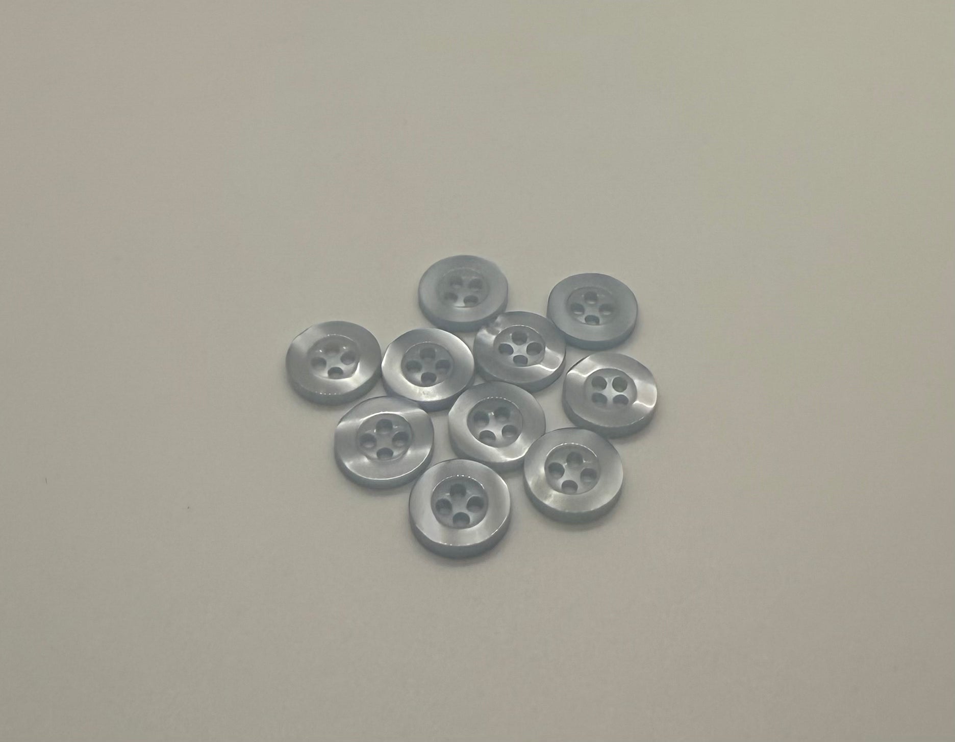 Close-up image of Pool water Blue Resin, a premium quality button.