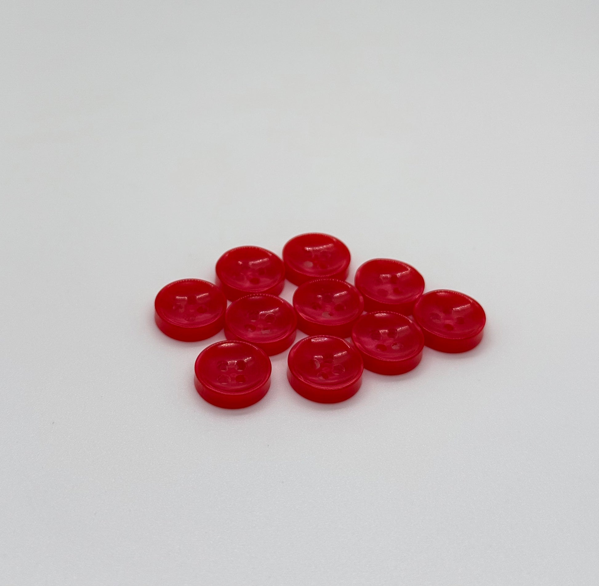 Close-up image of Red Sunken Button, a premium quality button.
