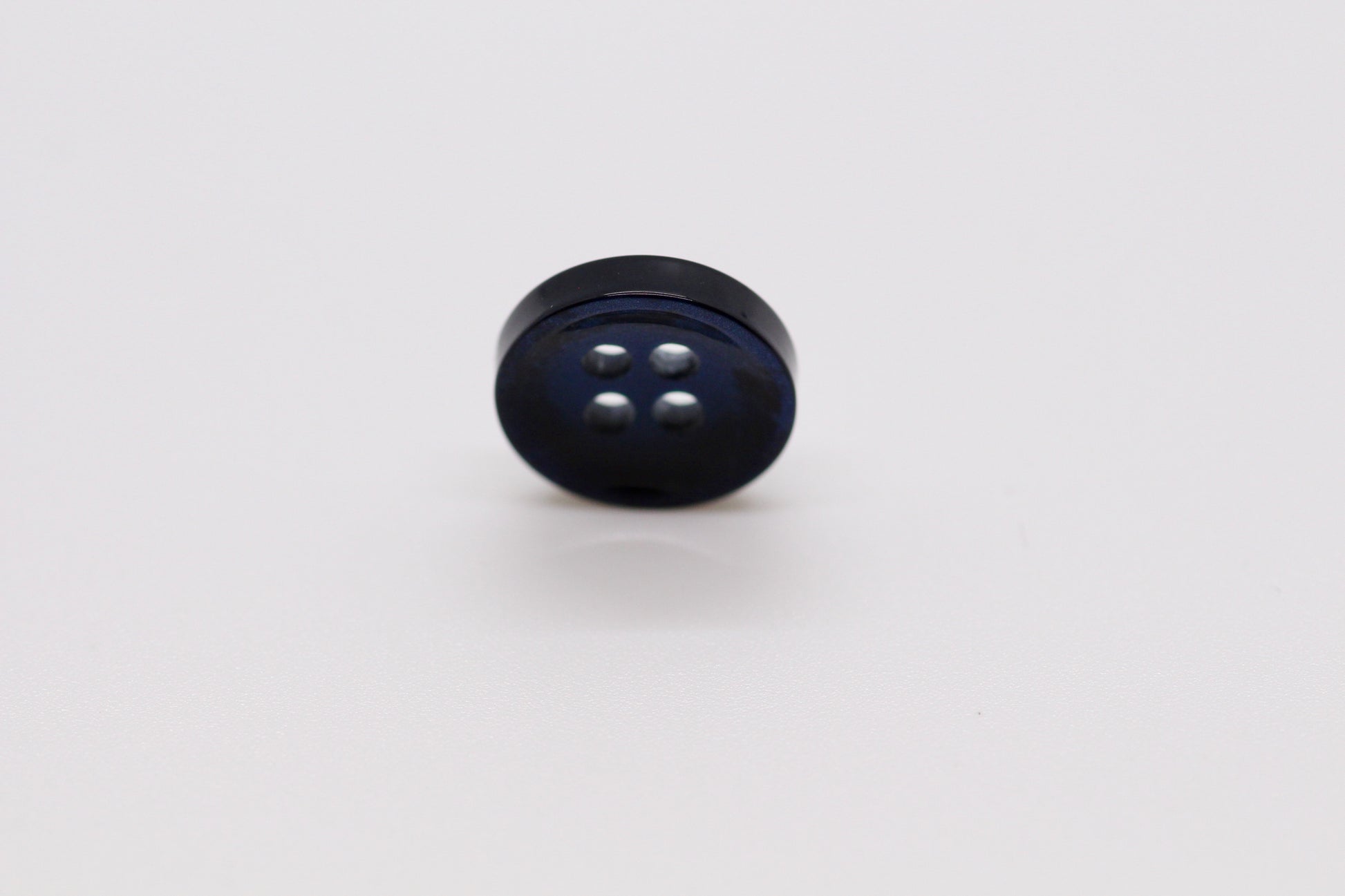 Close-up image of Pearl Blue Sunken Button, a premium quality button.