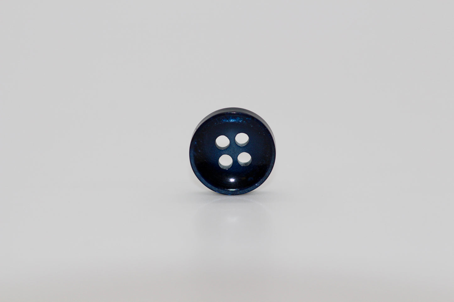 Close-up image of Pearl Blue Sunken Button, a premium quality button.