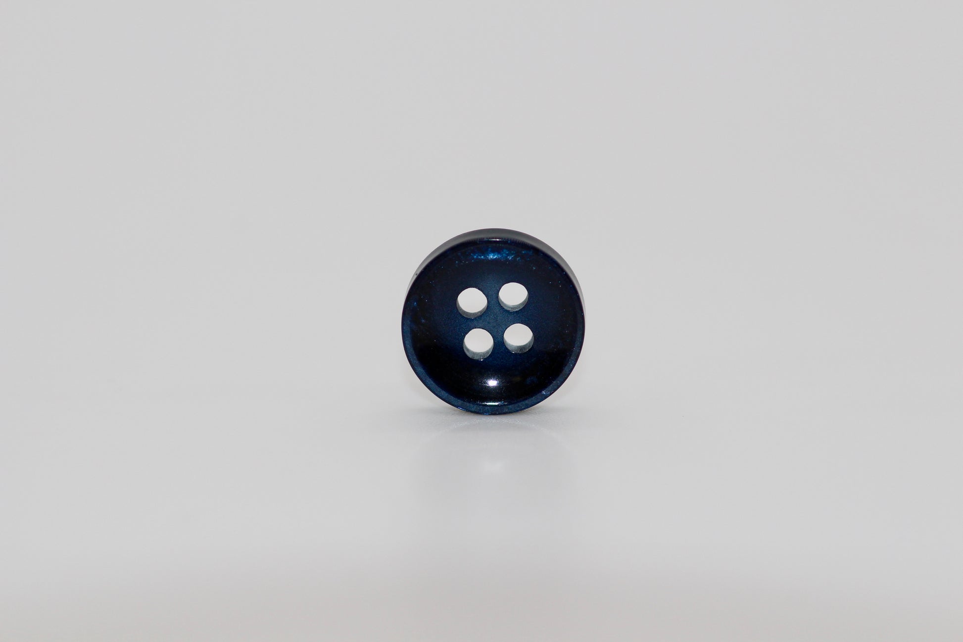 Close-up image of Pearl Blue Sunken Button, a premium quality button.