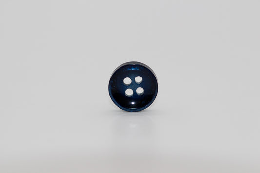 Close-up image of Pearl Blue Sunken Button, a premium quality button.