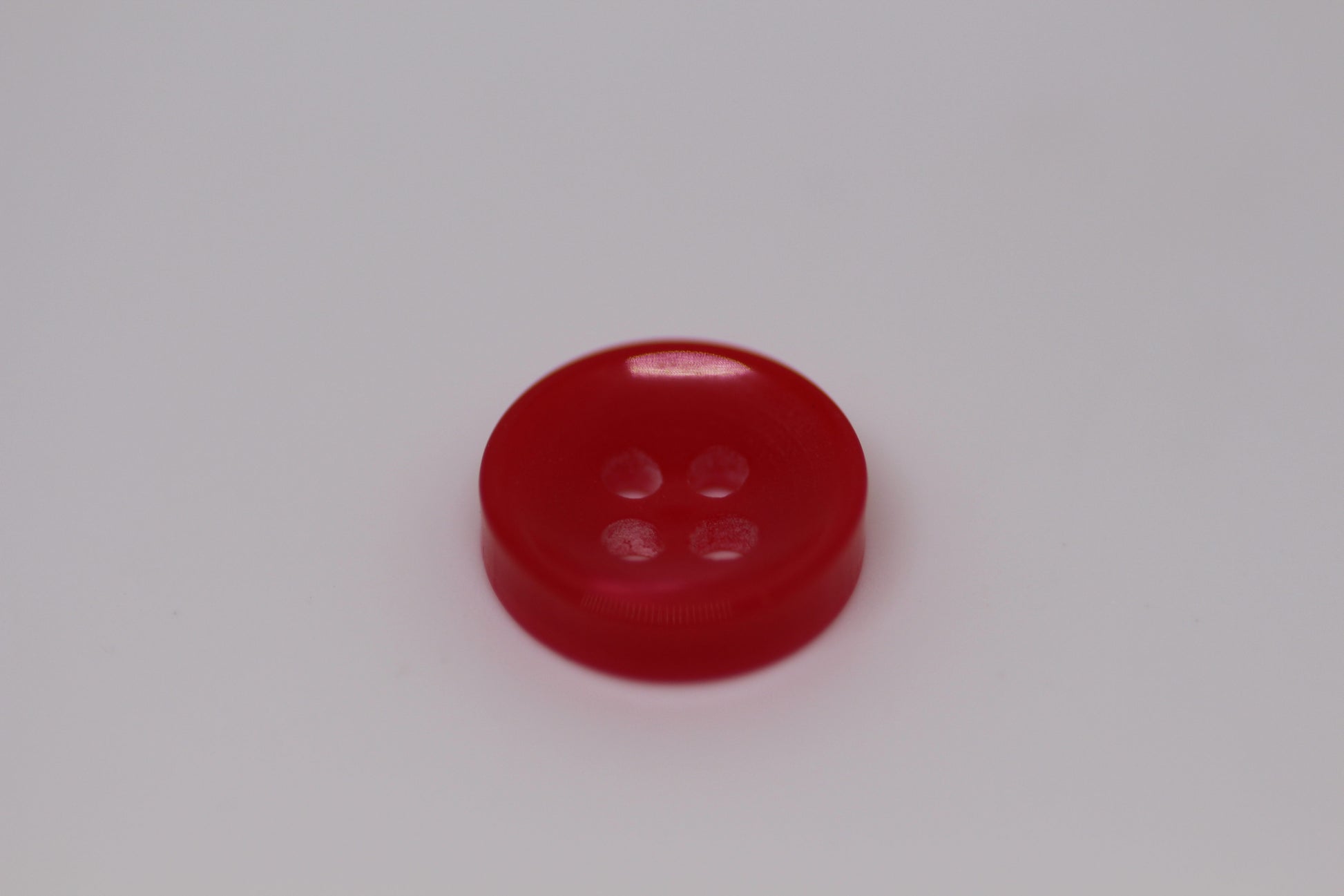 Close-up image of Red Sunken Button, a premium quality button.