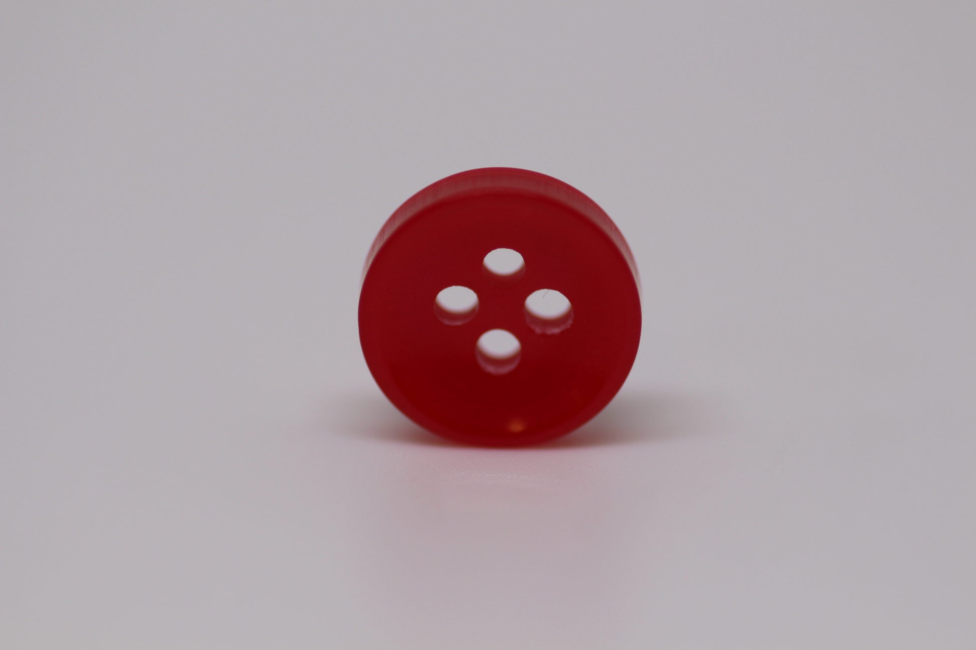 Close-up image of Red Sunken Button, a premium quality button.