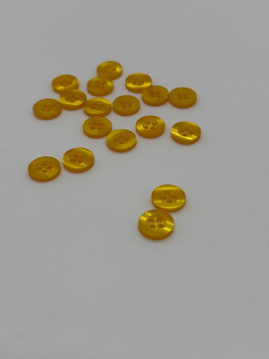 Close-up image of Fancy Amber Resin 4-Hole Button, a premium quality button.