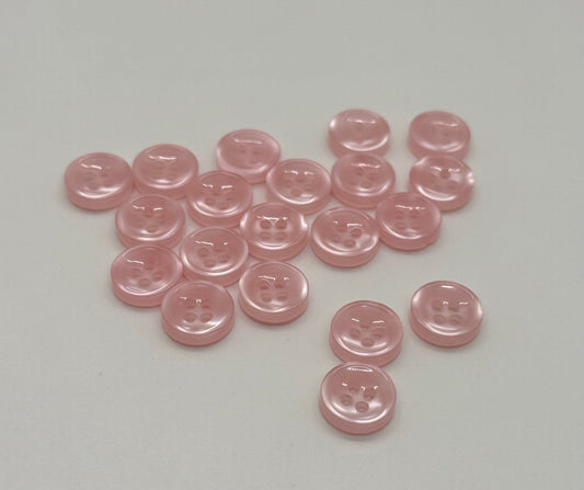 Close-up image of Blush Beam - Light Pink Iridescent 18-Ligne Button, a premium quality button.