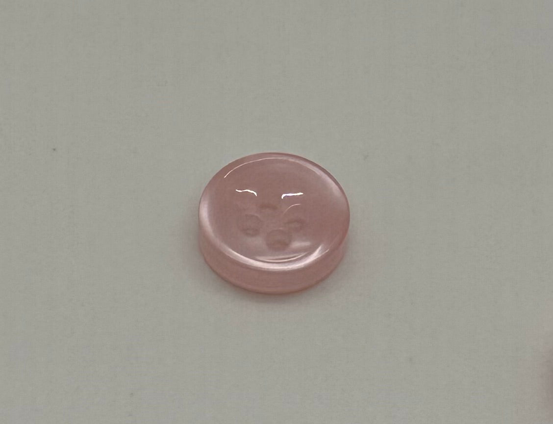 Close-up image of Blush Beam - Light Pink Iridescent 18-Ligne Button, a premium quality button.