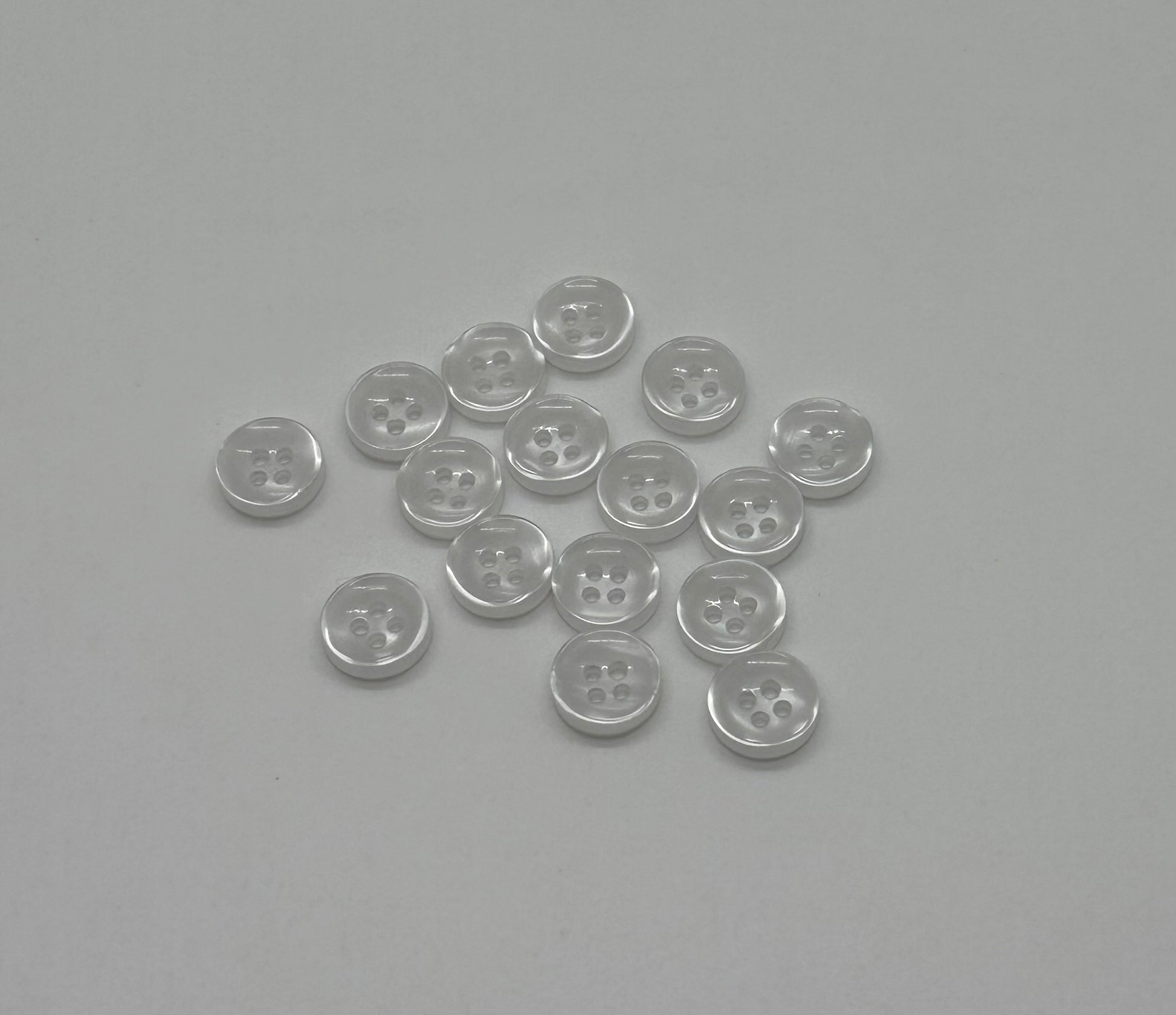 Close-up image of Faux Pearl - White Iridescent 18-Ligne Button, a premium quality button.