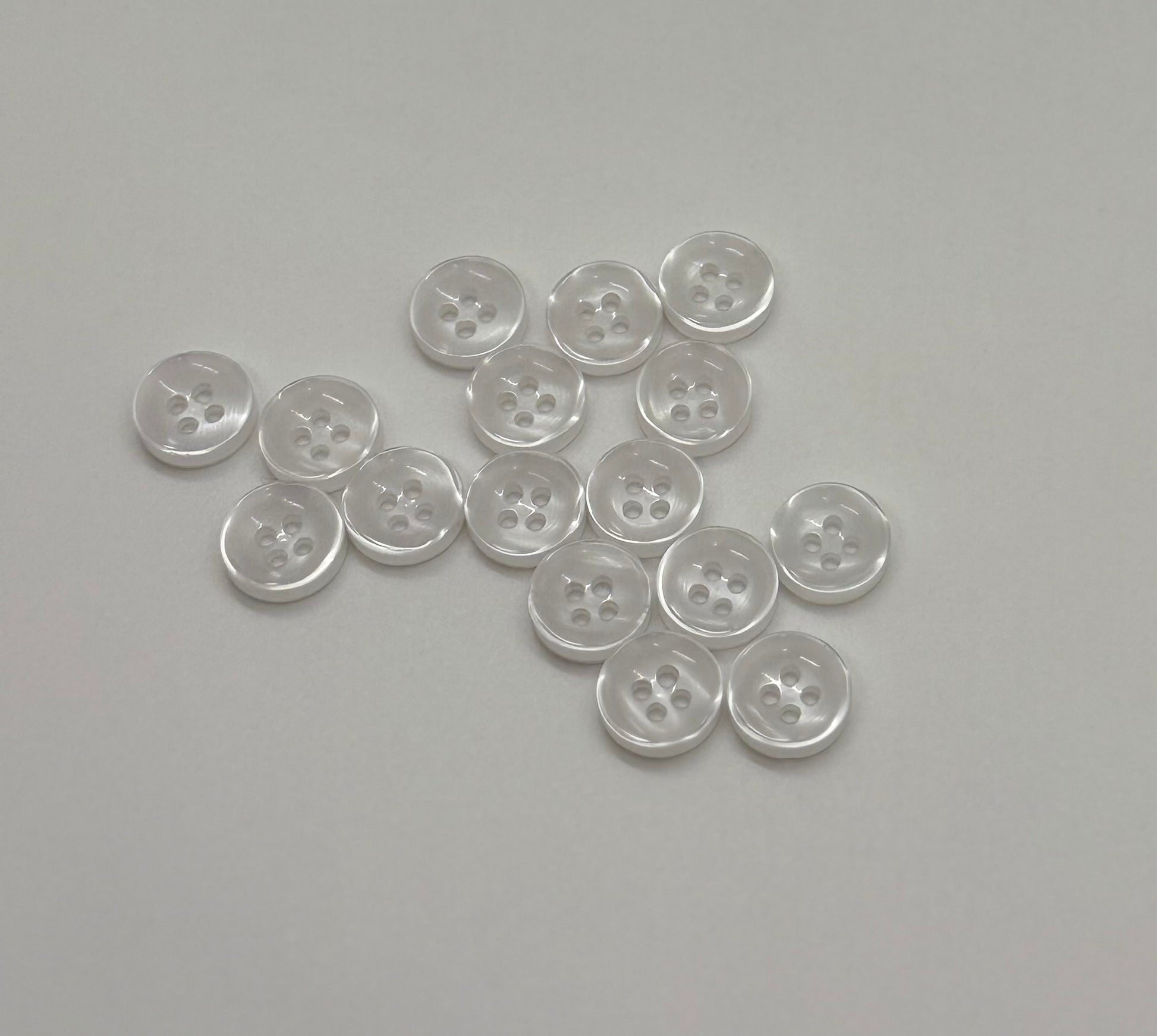 Close-up image of Faux Pearl - White Iridescent 18-Ligne Button, a premium quality button.