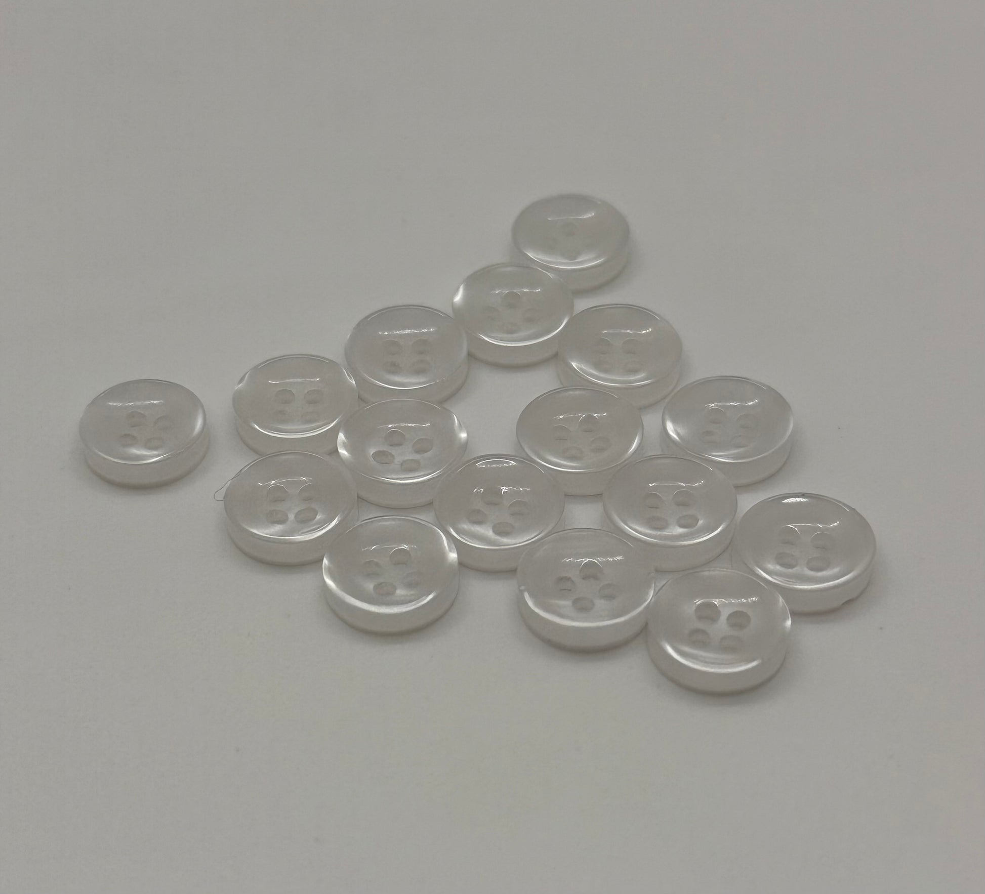 Close-up image of Faux Pearl - White Iridescent 18-Ligne Button, a premium quality button.