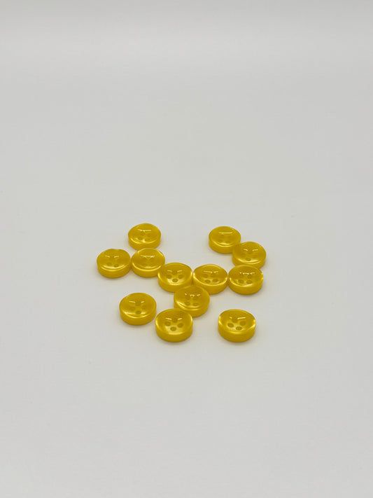 Close-up image of Golden Hour - Yellow Iridescent 18-Ligne Button, a premium quality button.