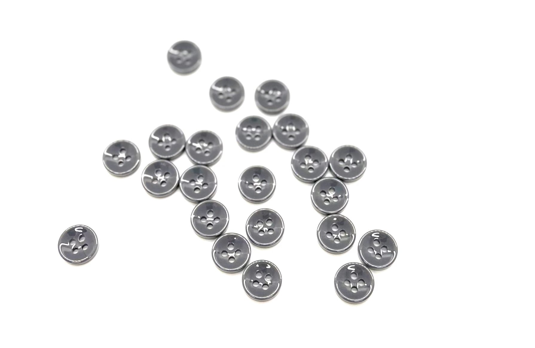 Close-up image of Grey Asphalt Fancy Resin 4-Hole Button, a premium quality button.