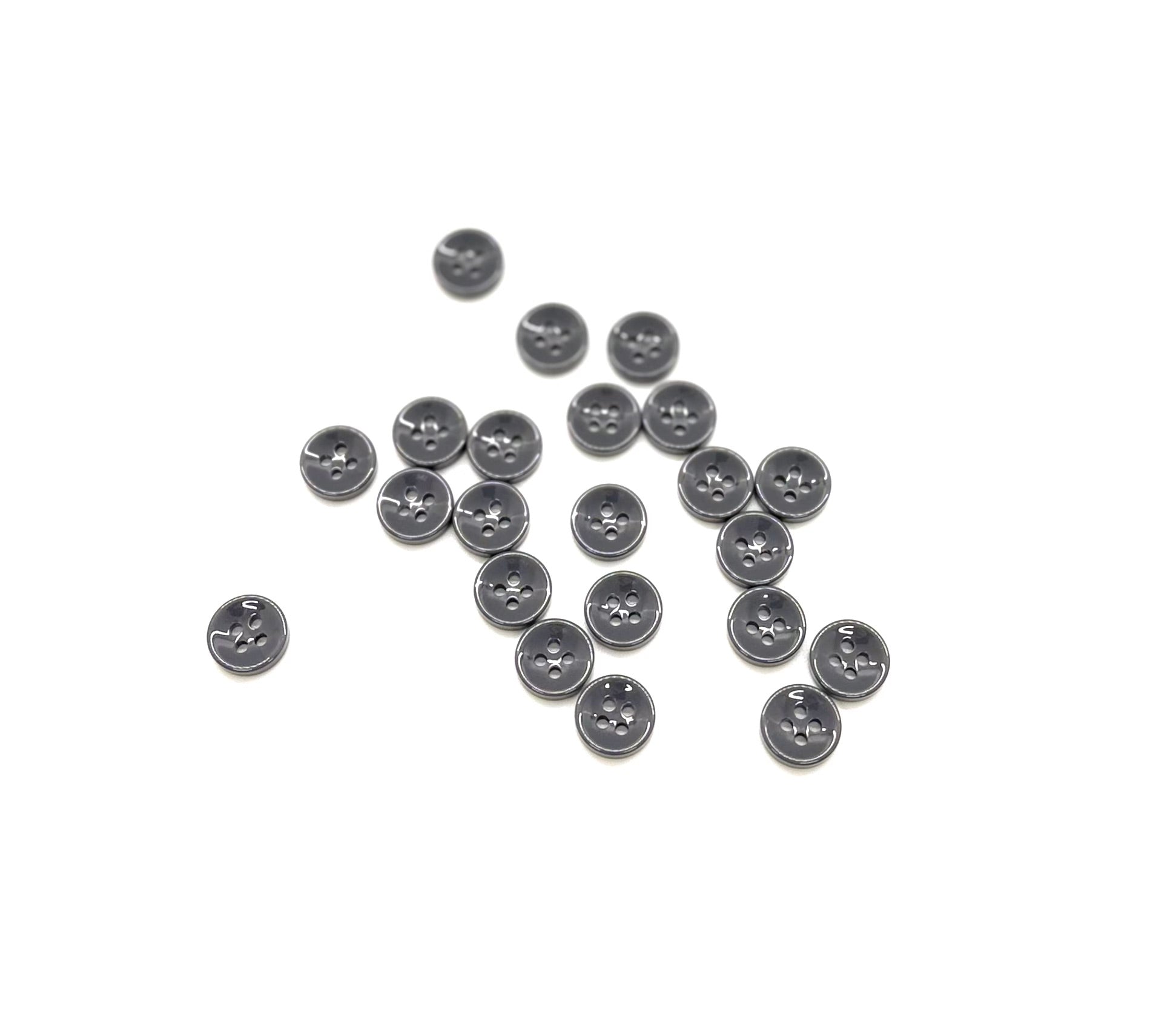 Close-up image of Grey Asphalt Fancy Resin 4-Hole Button, a premium quality button.