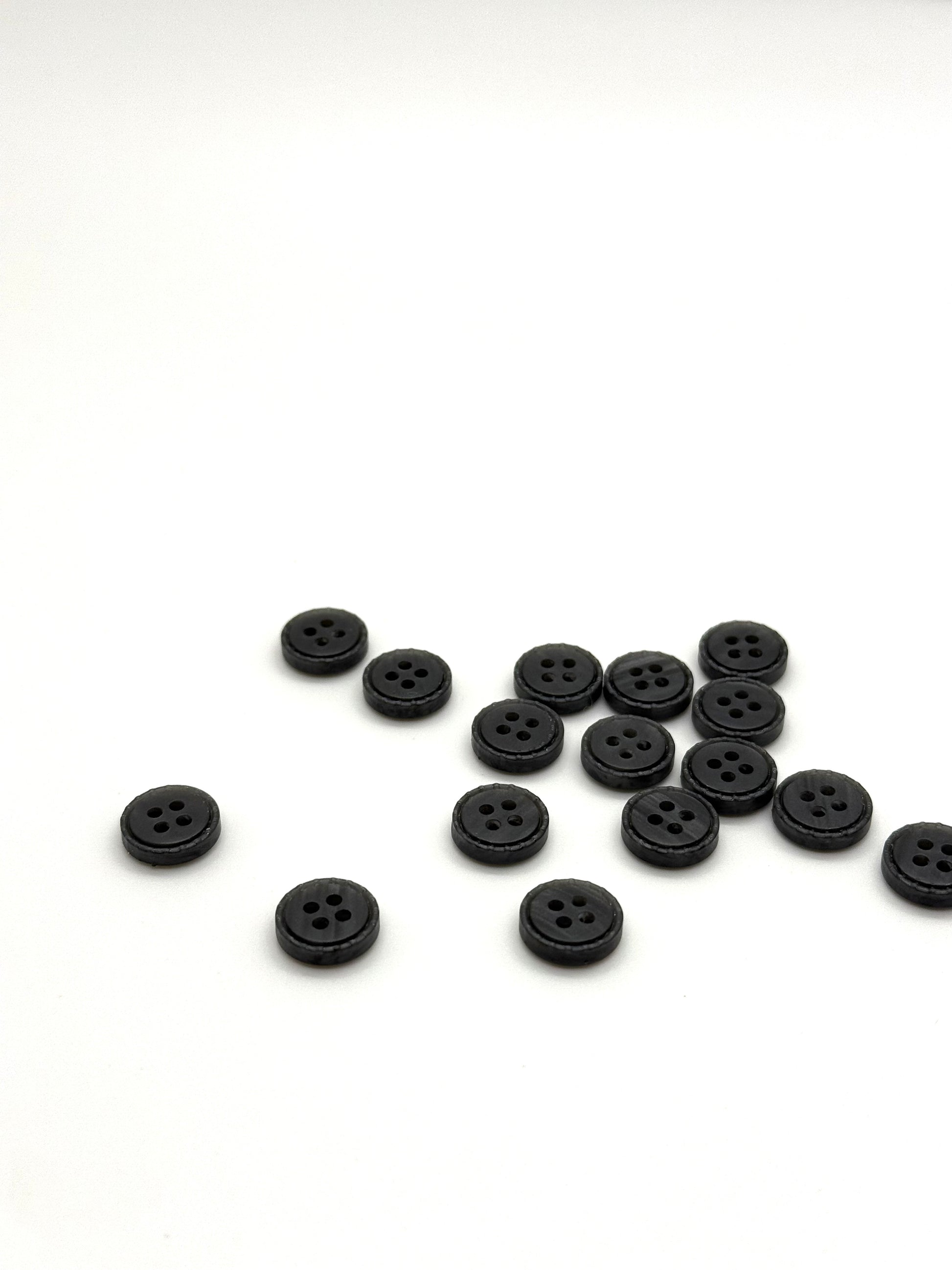 Close-up image of Iron Crest Rustic Grey - Engraved Edge Button, a premium quality button.