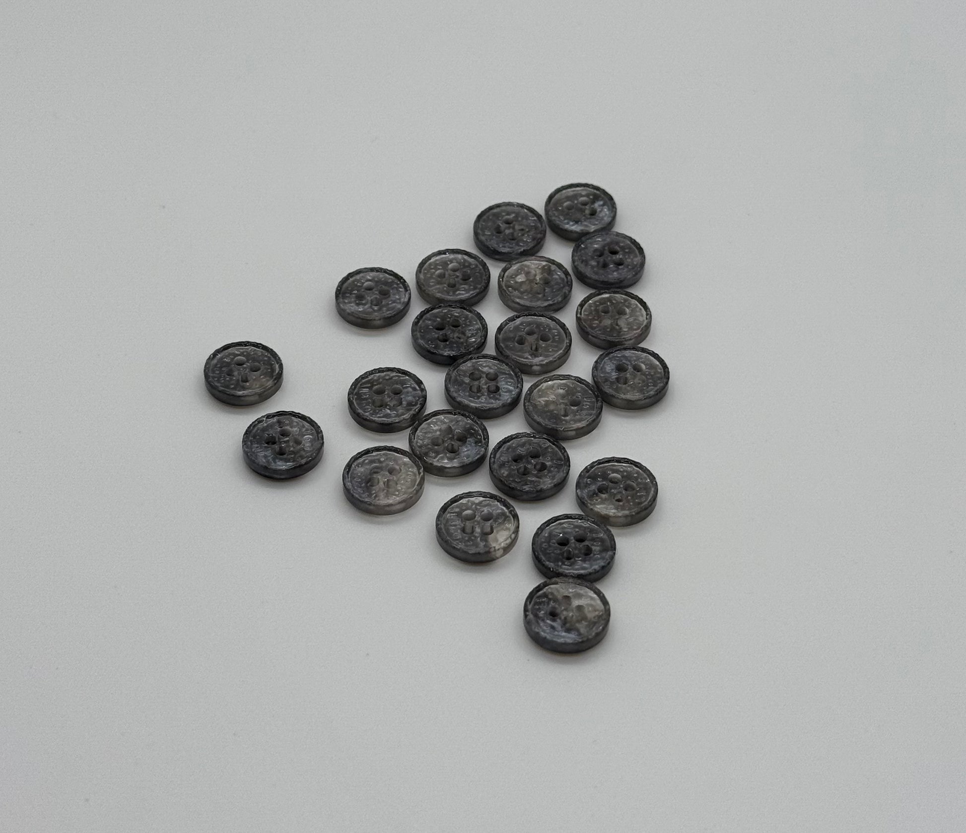 Close-up image of Starlit Silver Sparkle 4-Hole Button, a premium quality button.