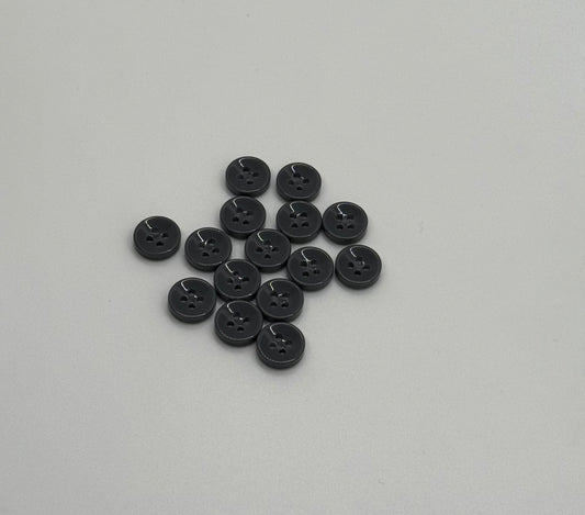 Close-up image of Urban Steel 4-Hole 18L Button, a premium quality button.