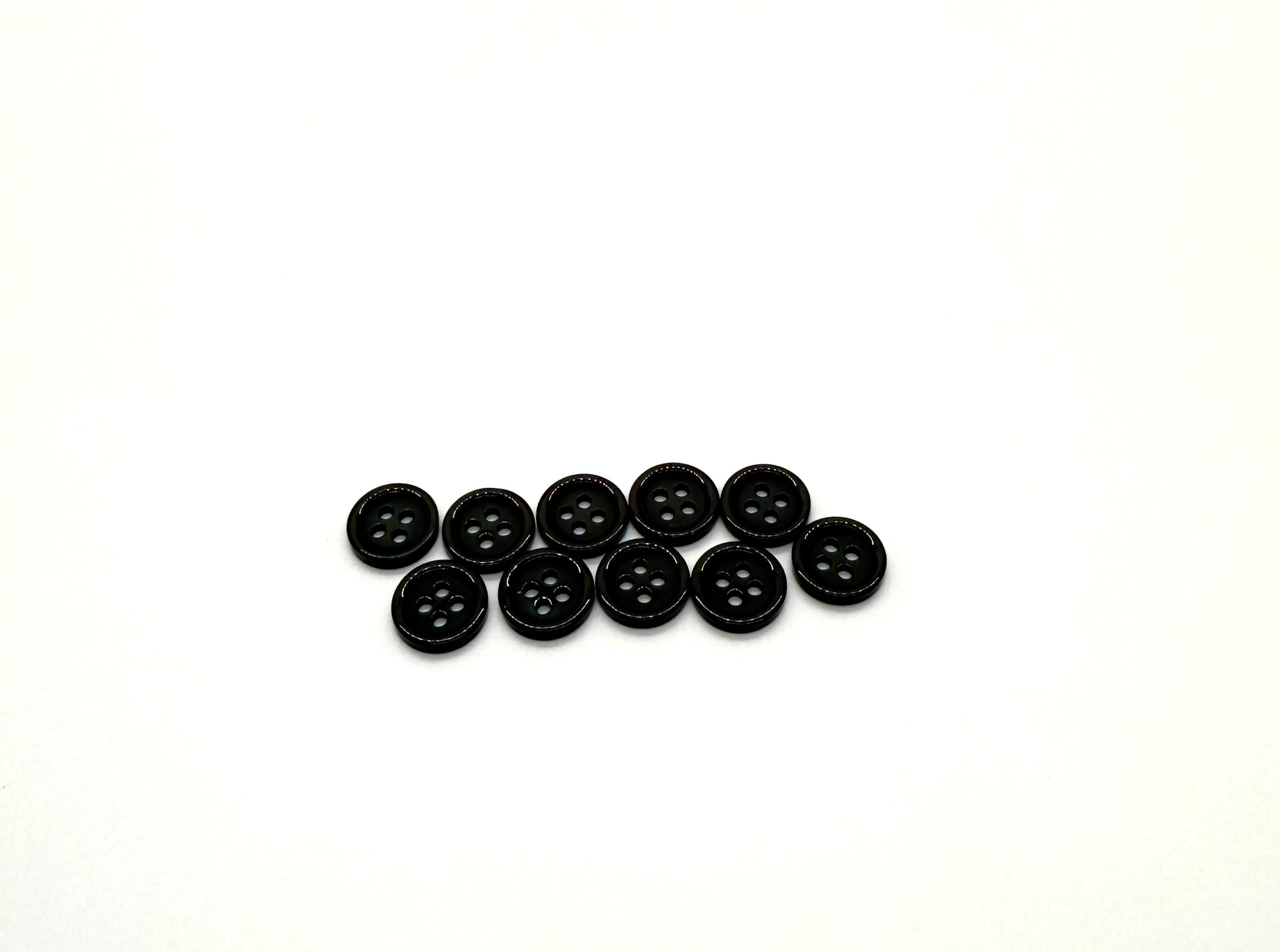 Close-up image of Black Pie Crust Polymer Button, a premium quality button.