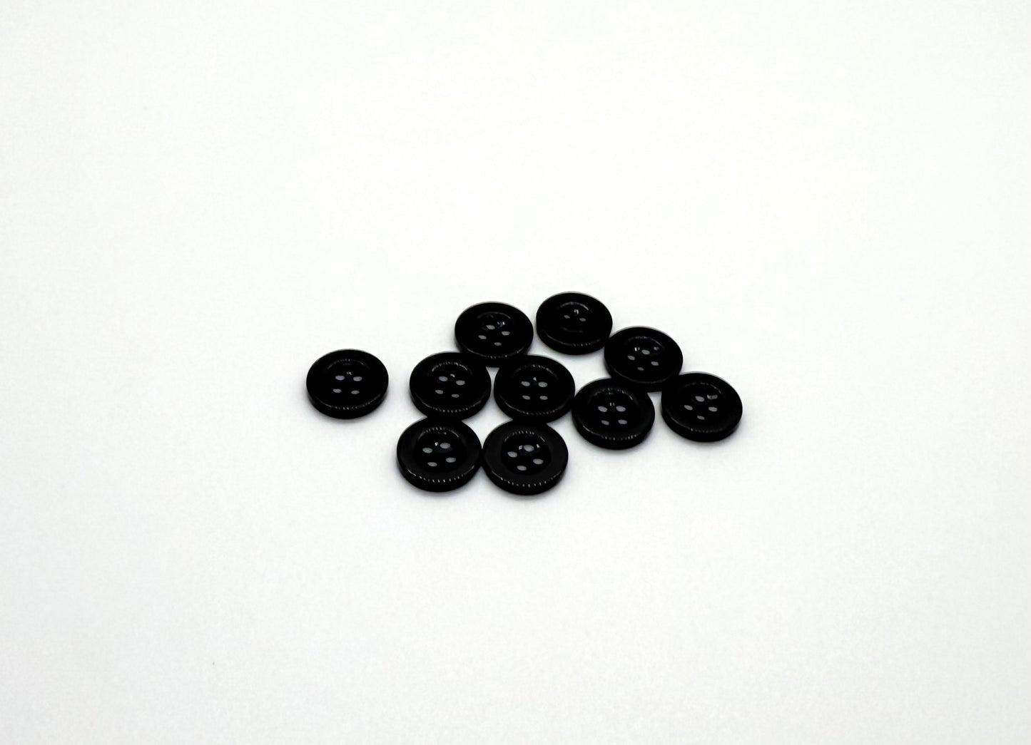 Close-up image of Black Sunken Resin, a premium quality button.