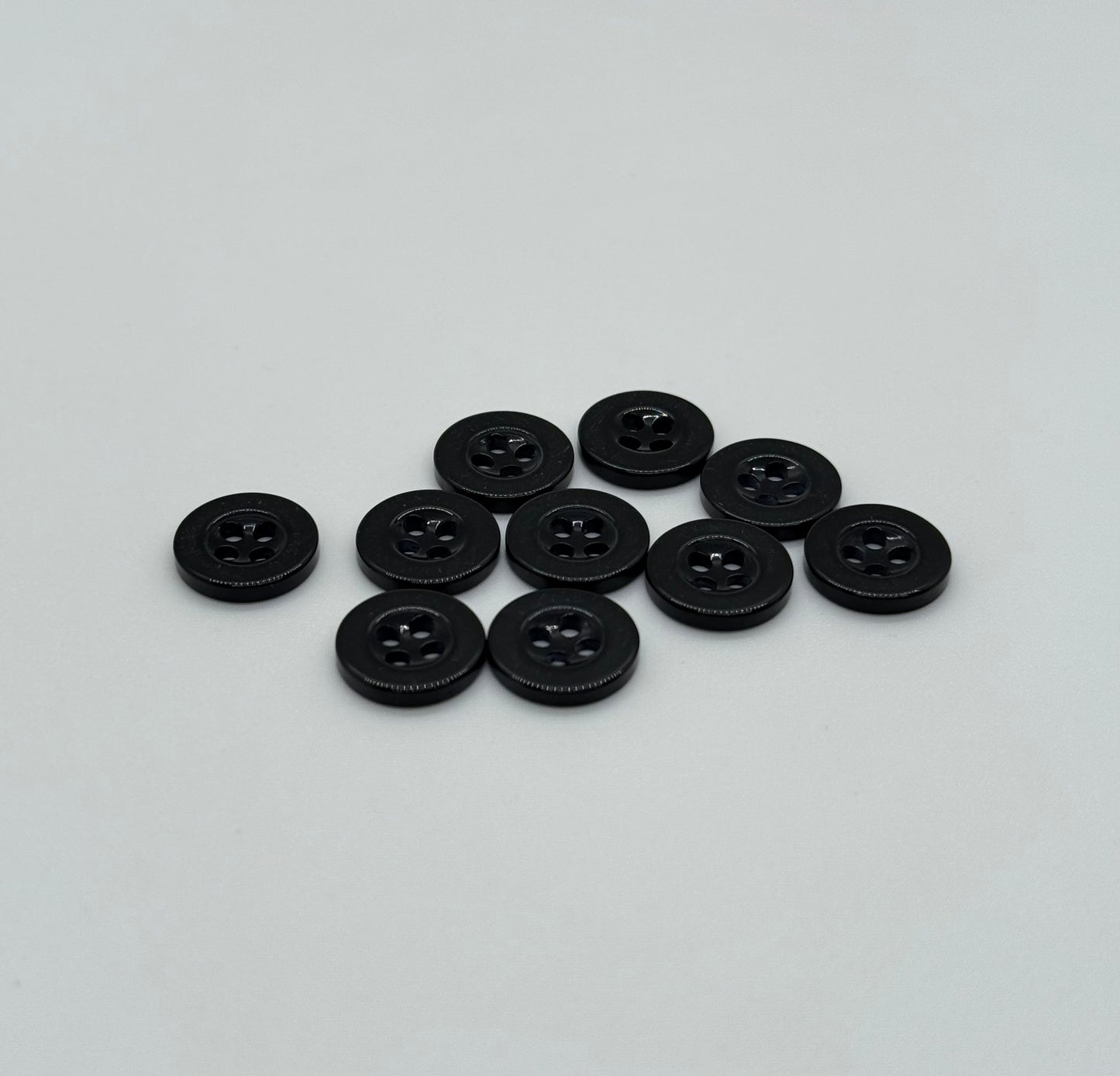 Close-up image of Black Sunken Resin, a premium quality button.
