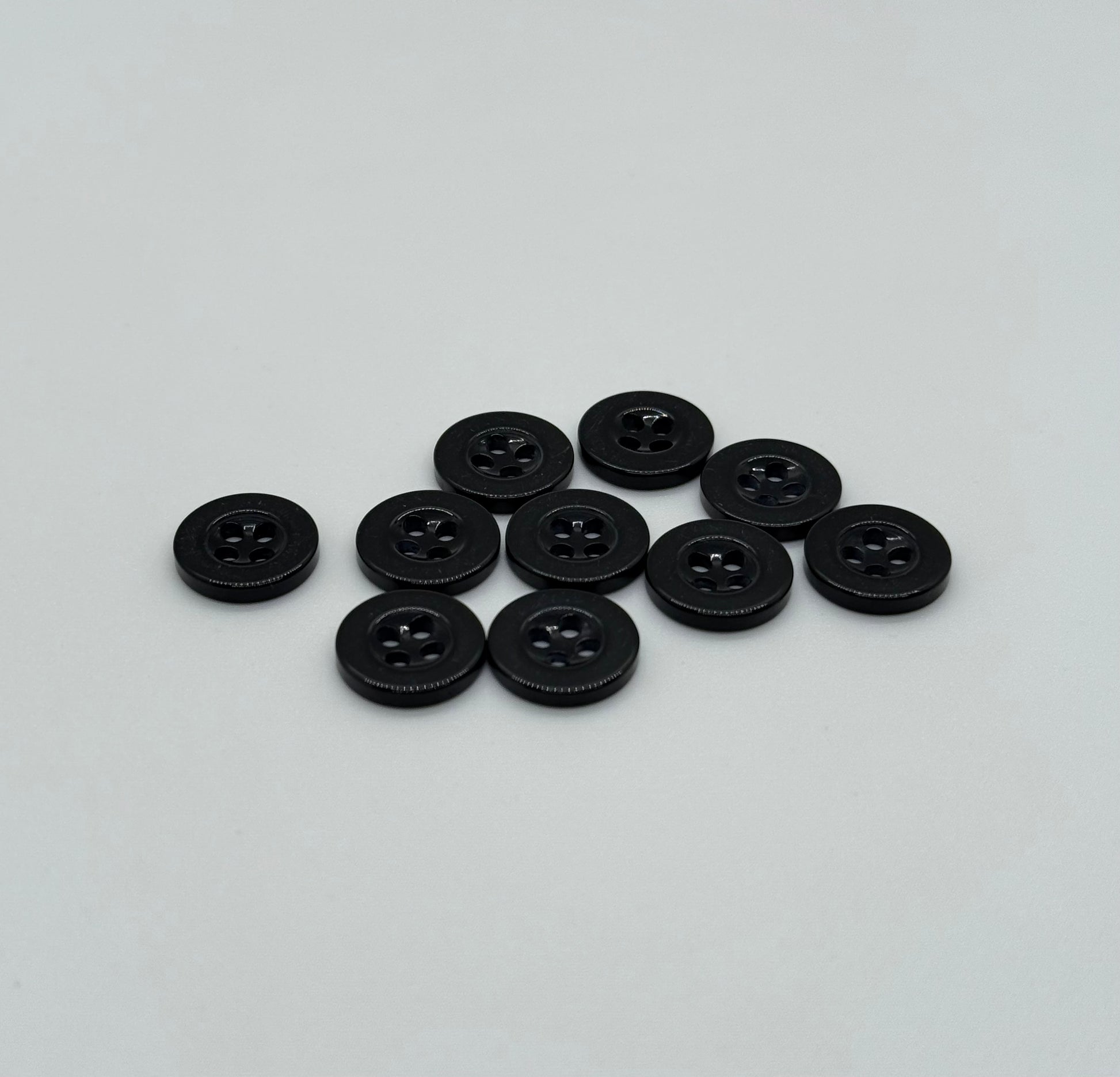 Close-up image of Black Sunken Resin, a premium quality button.
