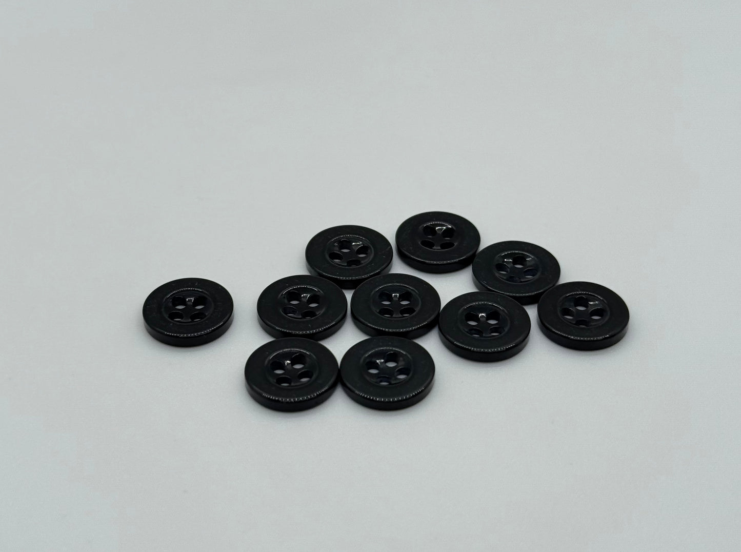 Close-up image of Black Sunken Resin, a premium quality button.
