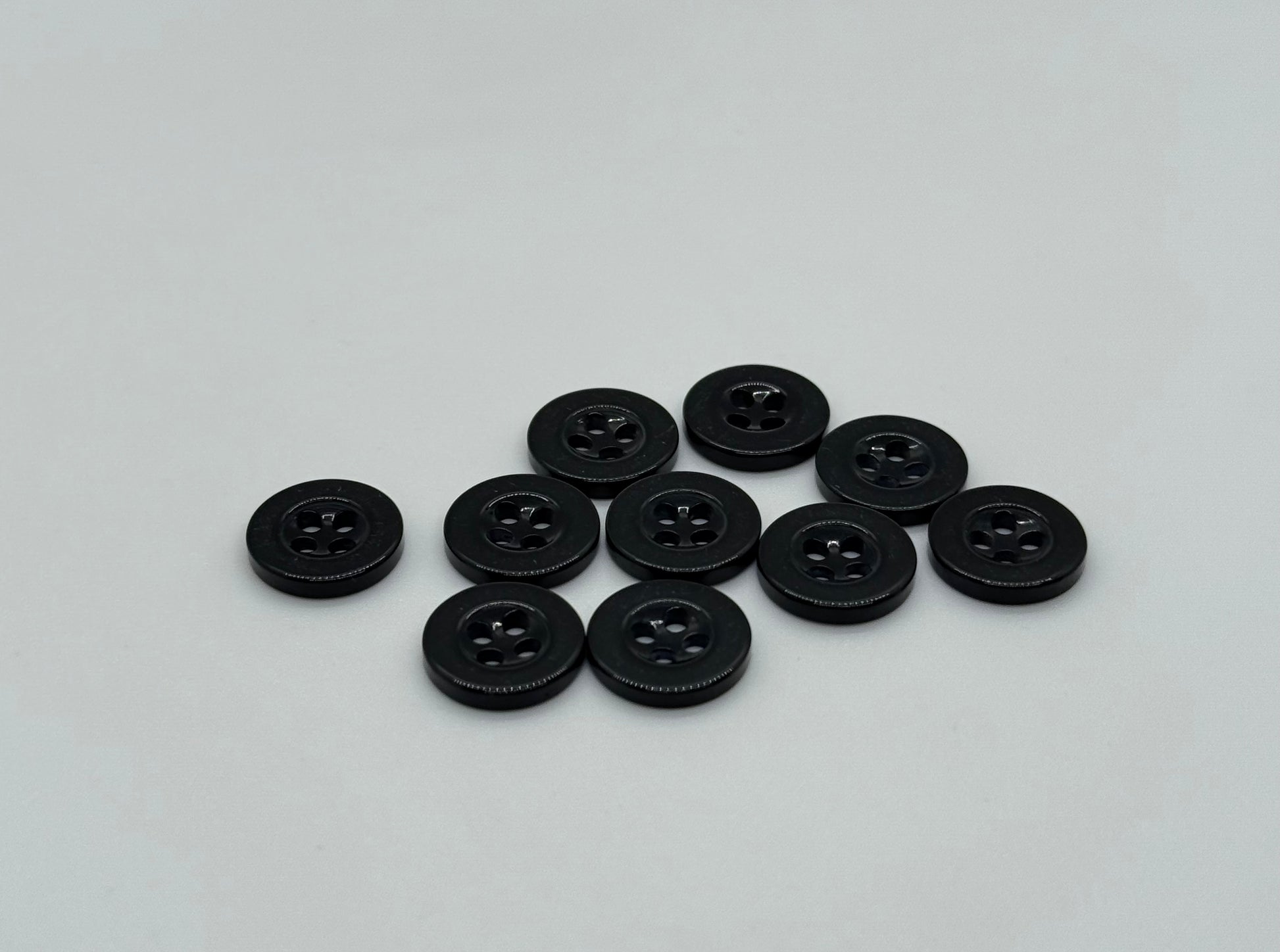 Close-up image of Black Sunken Resin, a premium quality button.