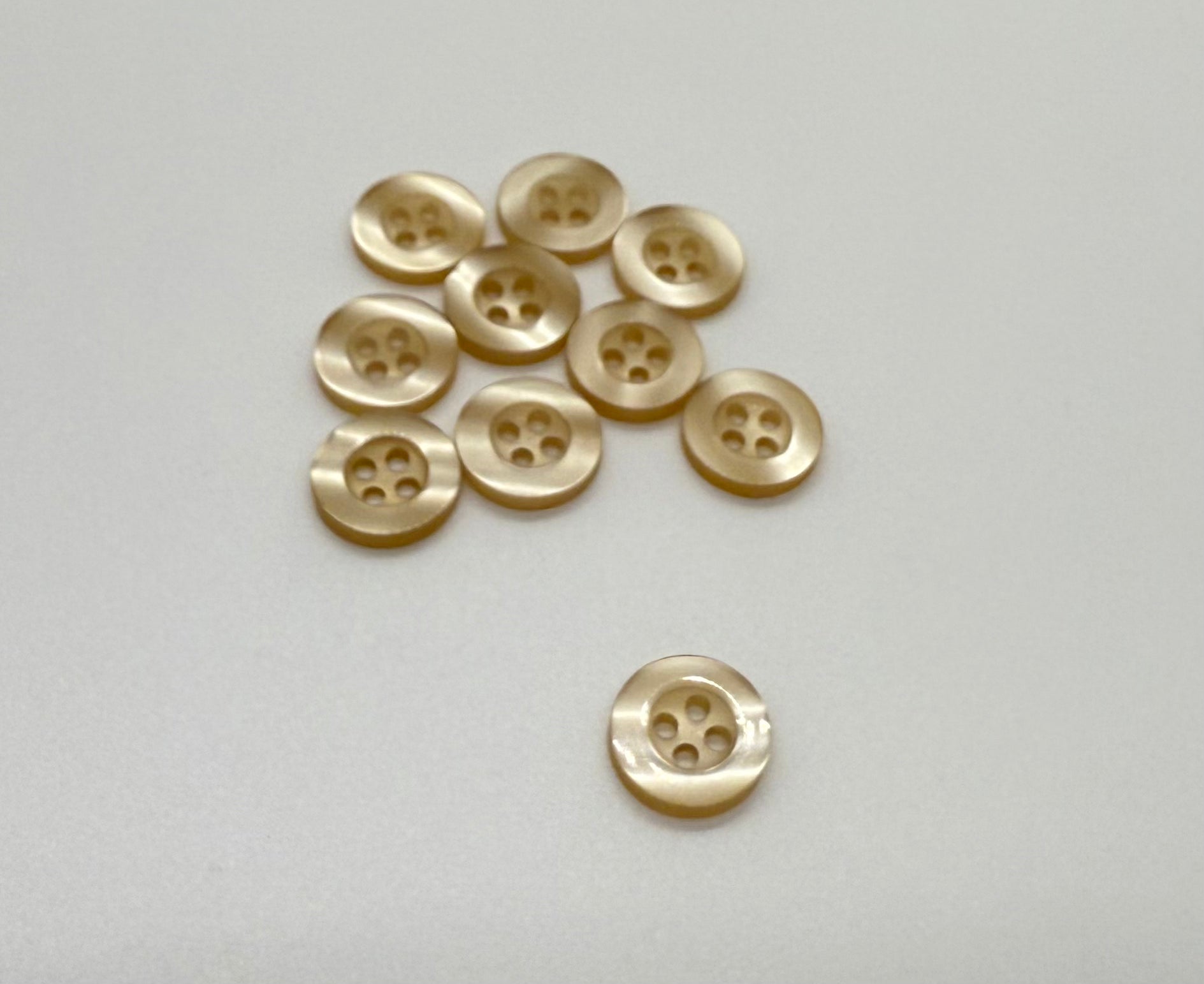 Close-up image of Balsa Cream Resin, a premium quality button.