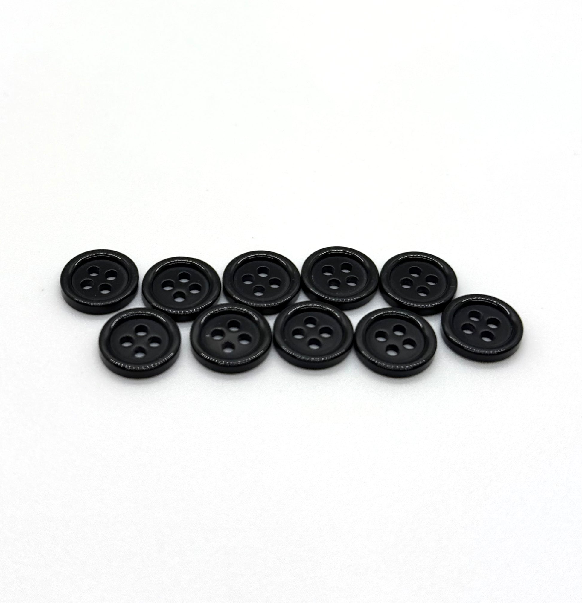 Close-up image of Black Pie Crust Polymer Button, a premium quality button.