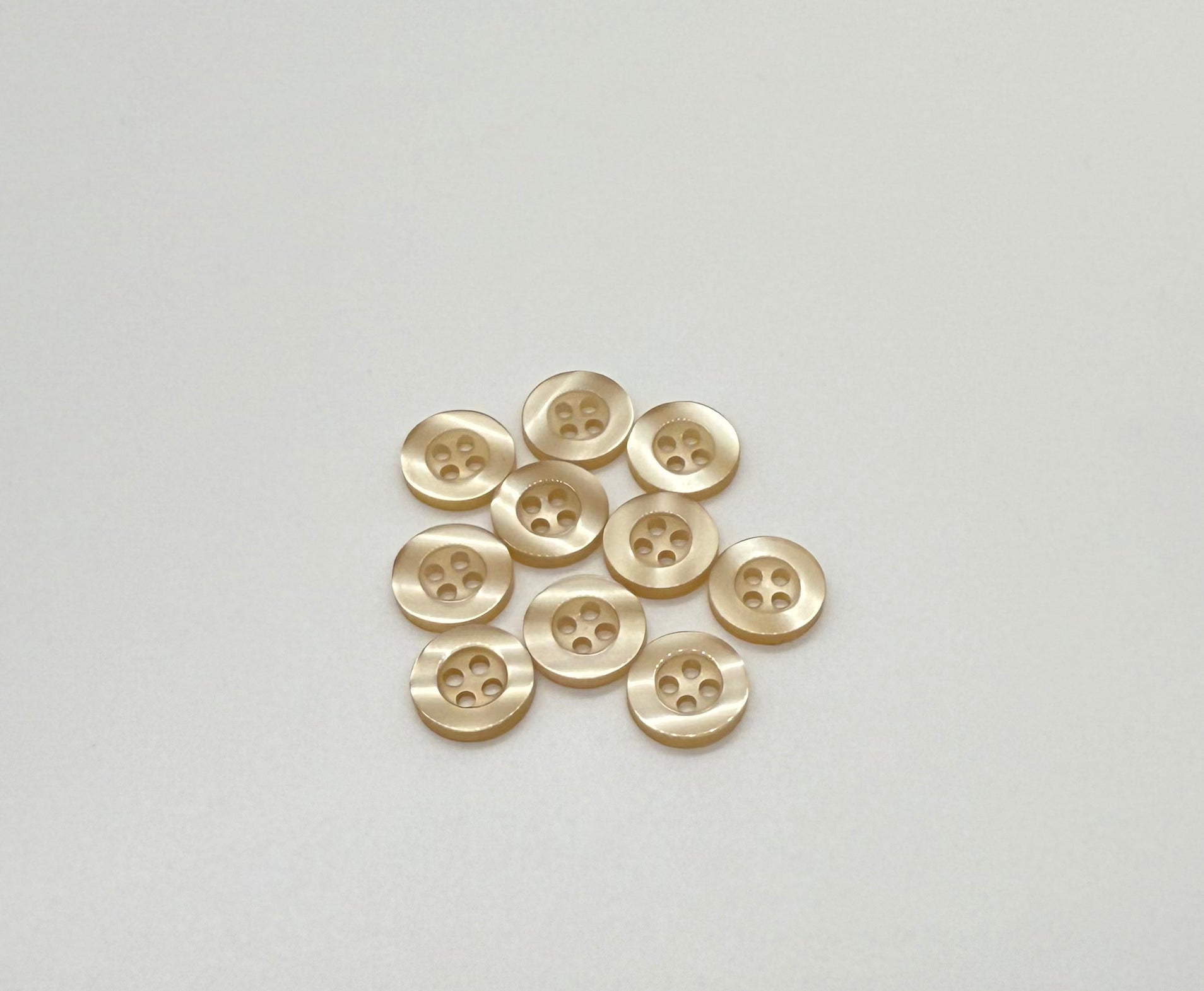 Close-up image of Balsa Cream Resin, a premium quality button.