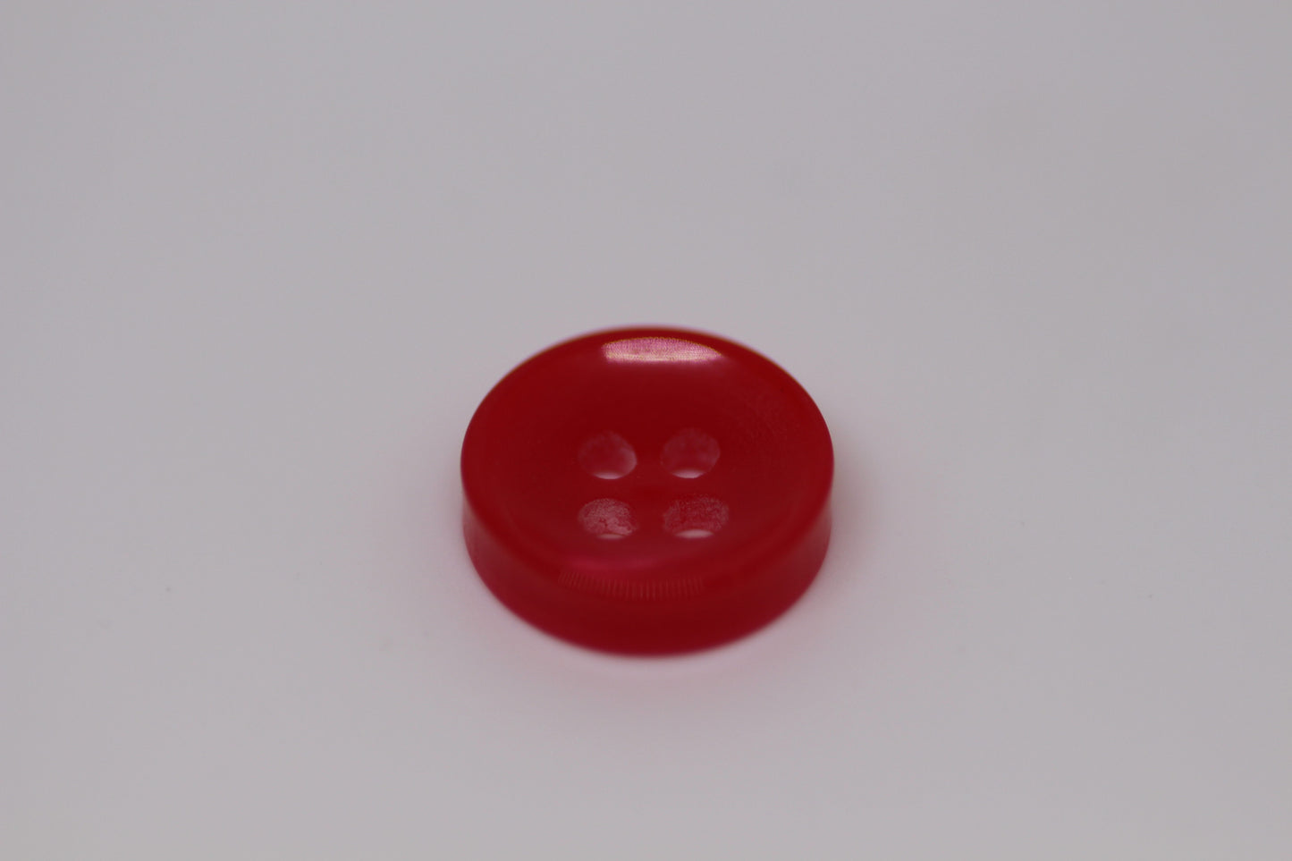 Close-up image of Red Sunken Button, a premium quality button.