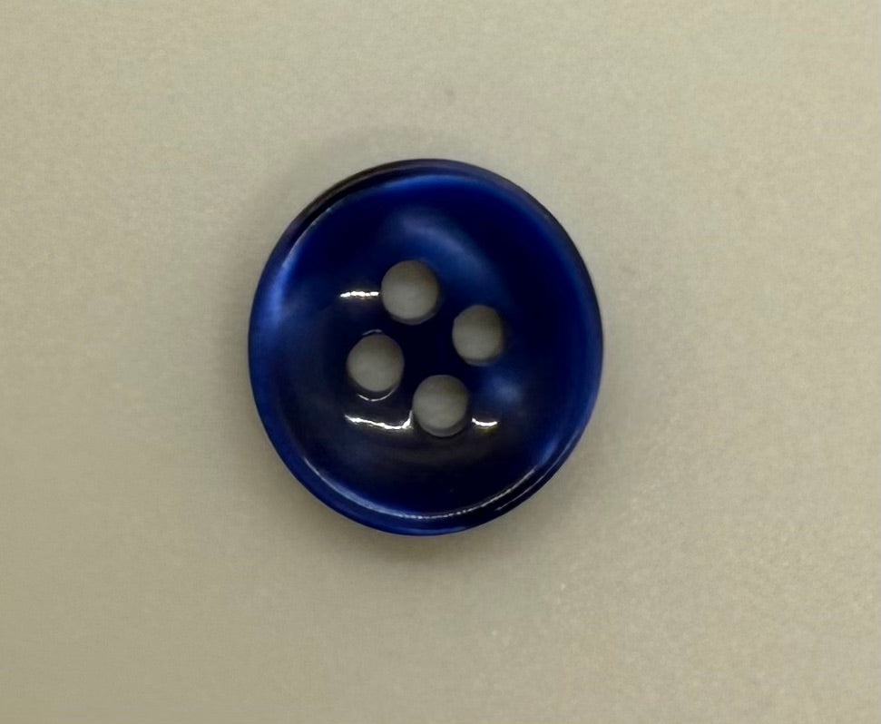 Close-up image of Azure Mirage - Blue Iridescent 18-Ligne Button, a premium quality button.