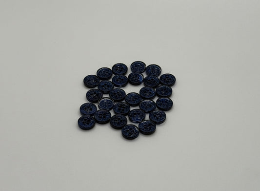Close-up image of Midnight Spark Fancy 4-Hole Button, a premium quality button.