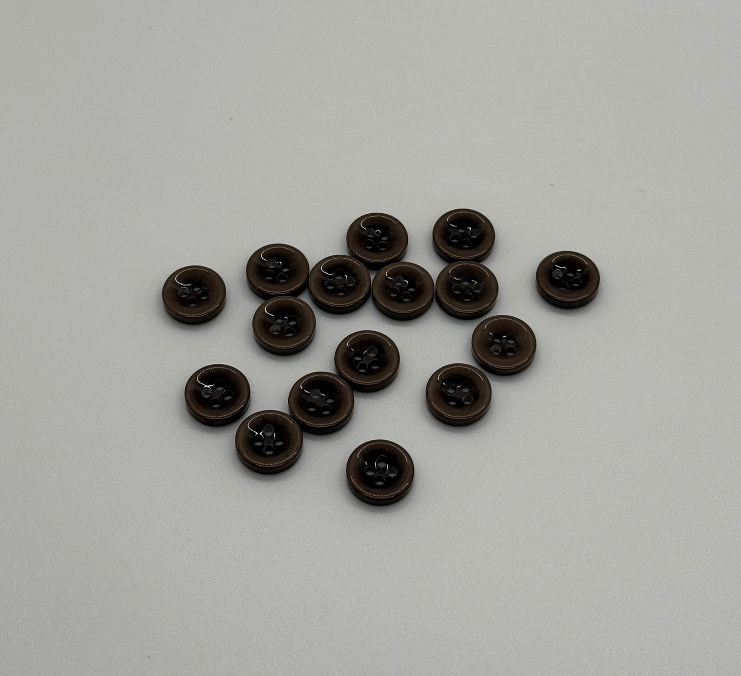 Close-up image of Mocha Drop 4-Hole Button, a premium quality button.