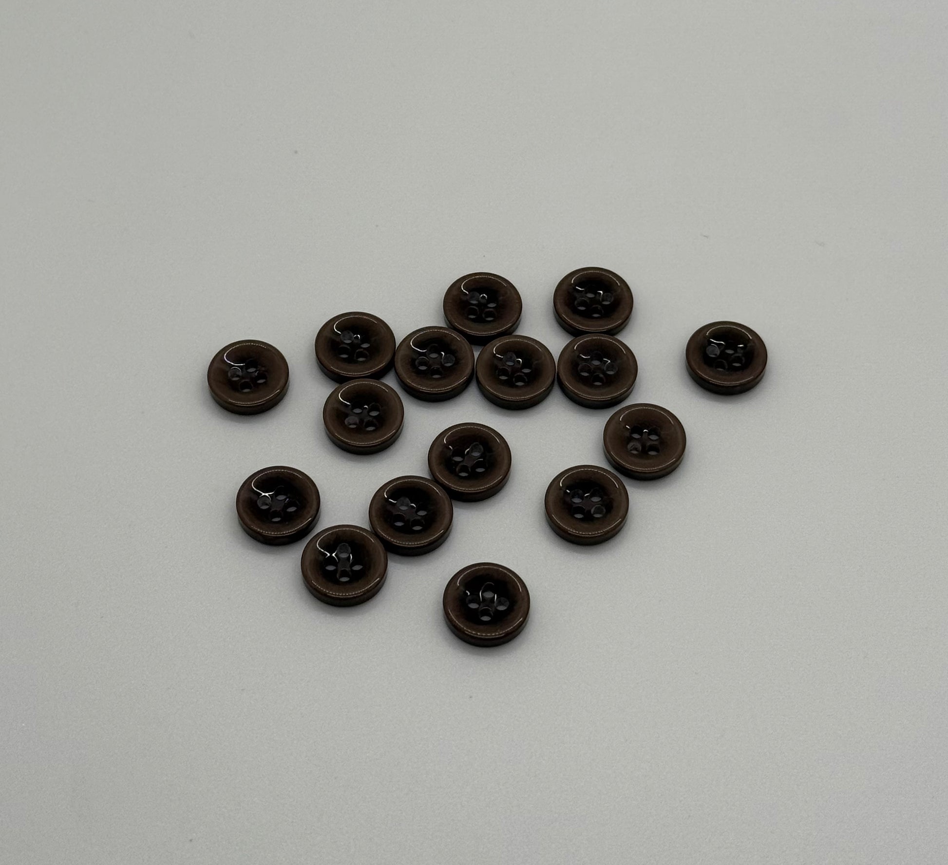 Close-up image of Mocha Drop 4-Hole Button, a premium quality button.