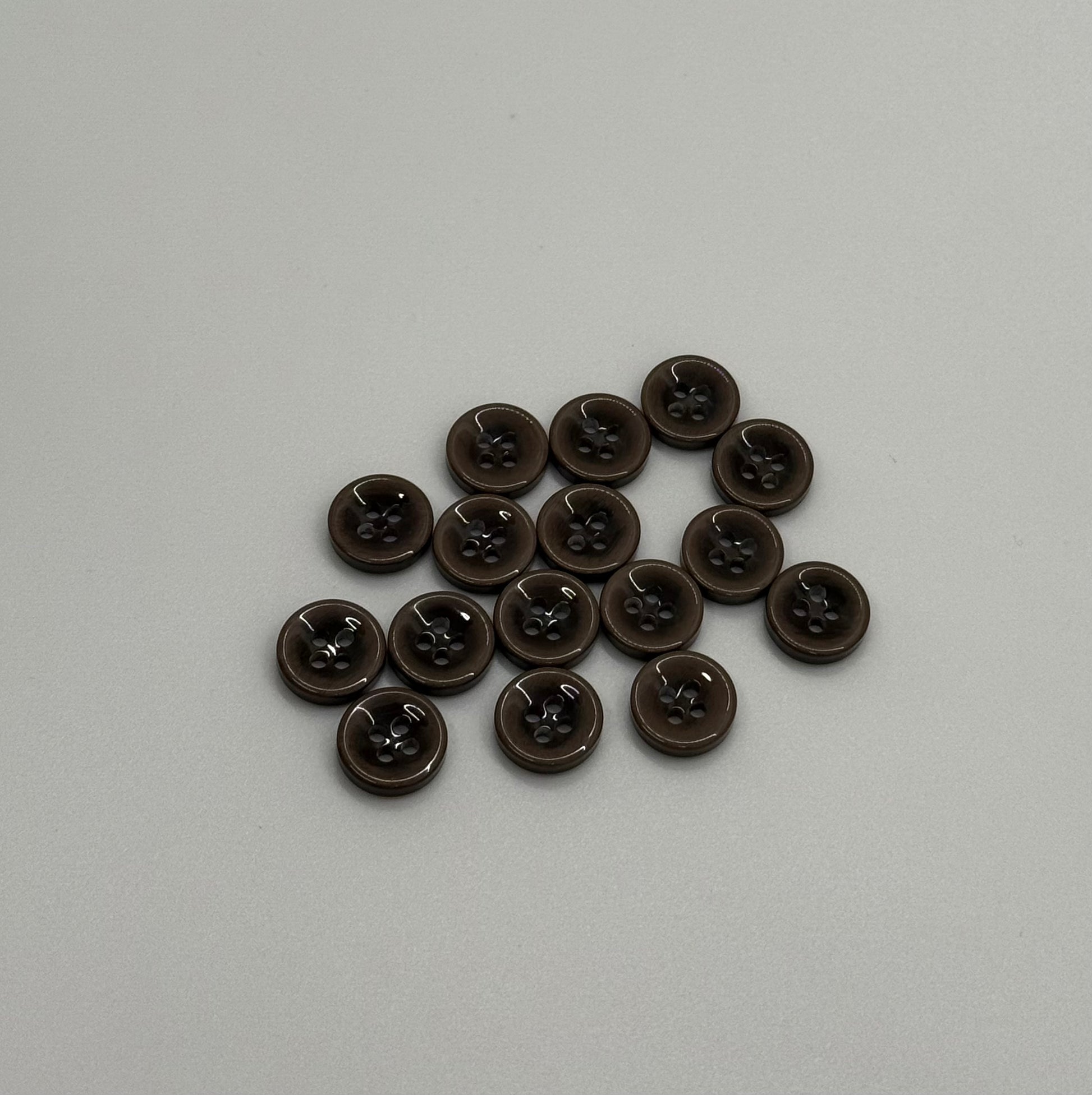Close-up image of Mocha Drop 4-Hole Button, a premium quality button.